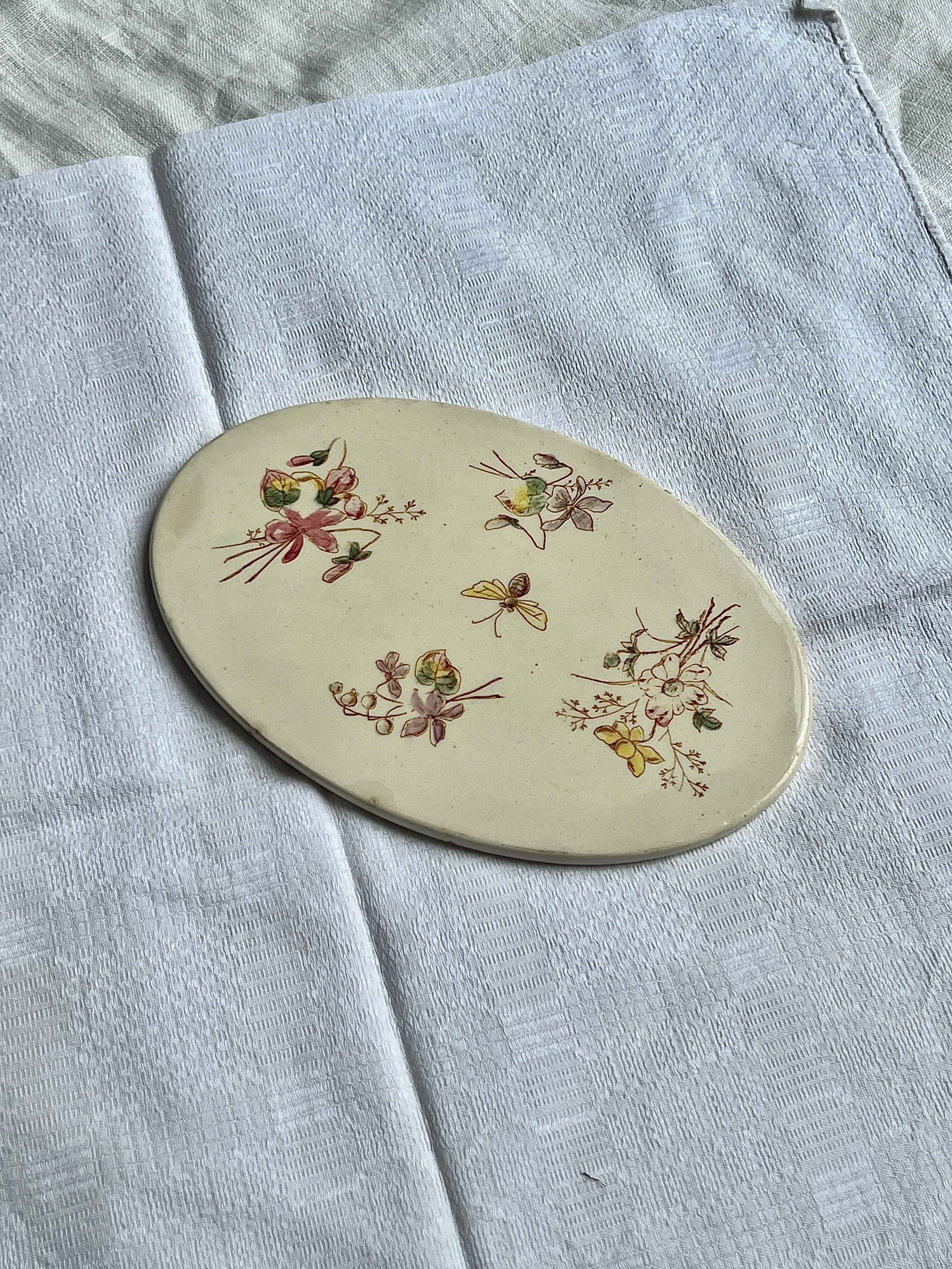 Håndmalet bordskåner i porcelæn