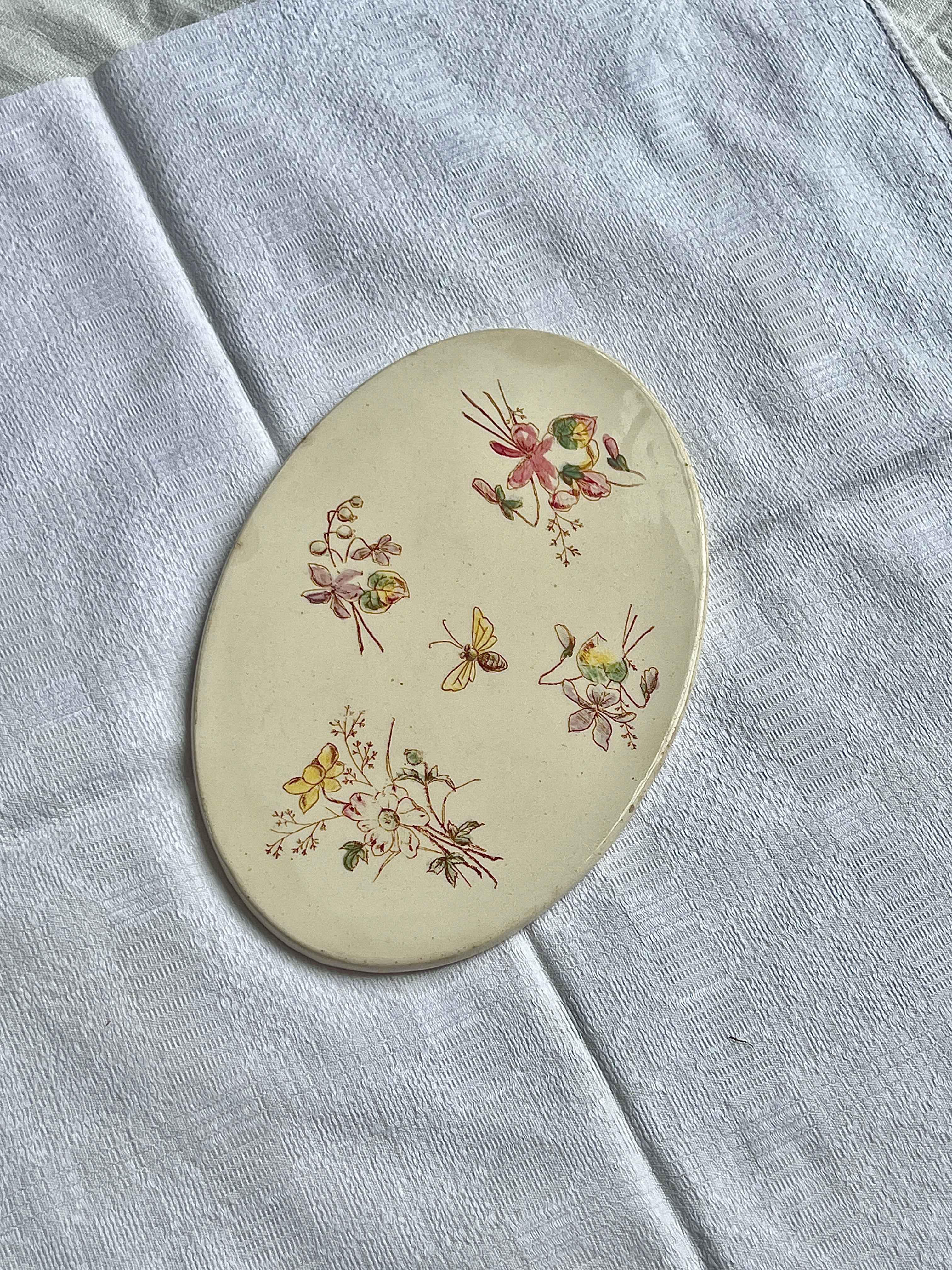 Håndmalet bordskåner i porcelæn